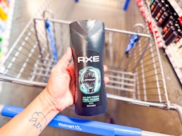 hand holding a bottle of Axe body wash