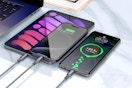 phones and a tablet charging on a table