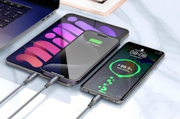 phones and a tablet charging on a table