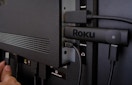 a Roku device plugged into a TV