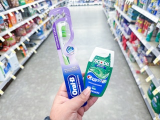 hand holding crest and oral-b walgreens