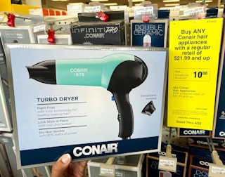 hand holding one Conair Turbo dryer box