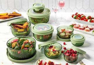 Red Anchor Hocking Glass Storage Set on a table surrounded by food.