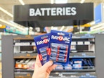 In-store photo of Rayvac Batteries at Walmart (8-pack held up in front of signage) 