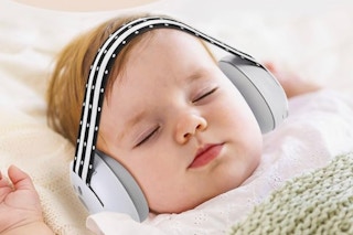 Baby sleeping with the Laudexua Noise Cancelling Headphones on.