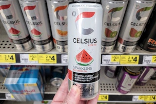 hand holding a can of celsius energy at dollar general