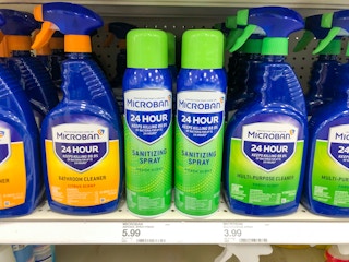 bottles of sanitizing spray and cleaner on store shelf