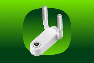 A boot, shoe or glove dryer with a white base and two vertical silver cylinders that give off heat