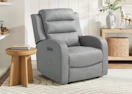 a grey recliner in a room