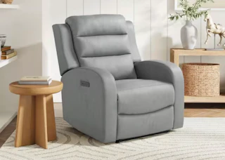 a grey recliner in a room