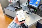 hand holding phone with 1-clip image