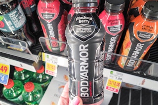 hand holding a bodyarmor sports drink at kroger