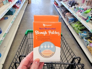 hand holding a box of blemish patches