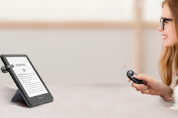 a woman using a remote page turner
