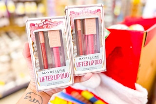 person holding 2 maybelline lifter lip duo gift sets