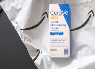 a bottle of cerave am facial moisturizing lotion on an amazon package