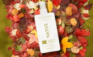 a bottle shampoo on fall leaves