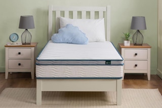 twin mattress on top of bed in room