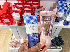 a hand holding mini travel-sized products