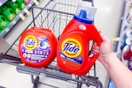 tide pods and liquid detergent in a walgreens cart
