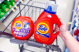 tide pods and liquid detergent in a walgreens cart