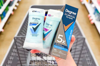 Hand holding Degree deodorants over a shopping cart