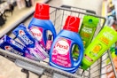 crest toothpaste, persil detergent, garnier shampoo, and sally hansen nail polish in a cart