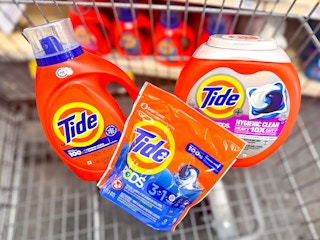 two Tide Pods and one Tide detergent inside cart