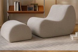 Lifestyle image of the beige boucle Christopher Knight Accent Chair & Ottoman in living room setting