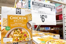 members mark chicken broth on store shelf with signage