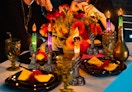 Halloween LED skeleton candles on a table with decorations