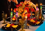 Halloween LED skeleton candles on a table with decorations