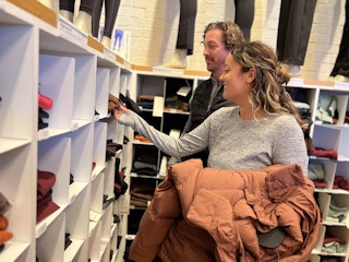 couple looking through women's clothing section specifically leggings