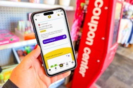 hand holding smartphone displaying a 1-clip coupon in the krazy coupon lady app