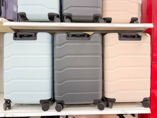open story hardside luggage sitting on a target shelf