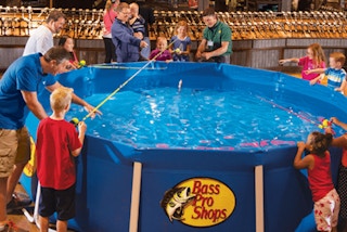 parents and their children fishing at bass pro shops