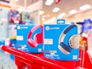 2 jlab kids' wireless kids headphones sitting on a target cart