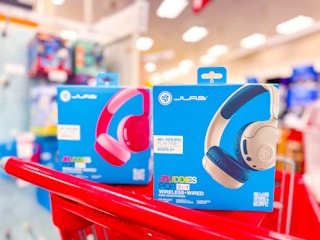 2 jlab kids' wireless kids headphones sitting on a target cart
