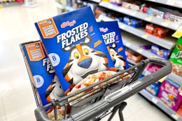 3 boxes of kellogg's frosted flakes in a cart