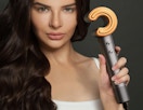 a person holding a hair dryer