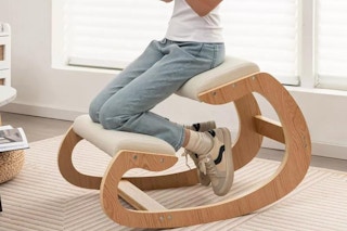 lifestyle image of a person using an ergonomic kneeling chair