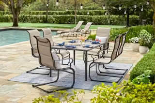Lifestyle image of Hampton Bay 7-piece Patio Set outdoors near a pool