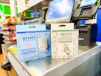 2 Mrs. Meyer's diffusers sitting in front of a Walmart checkout