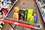 garnier, loreal, ogx shampoos and maybelline eyeshadow in a cart