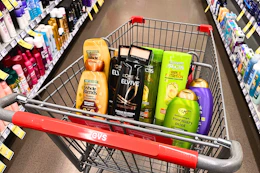 garnier, loreal, ogx shampoos and maybelline eyeshadow in a cart