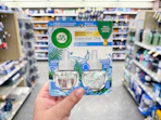 hand holding air wick refills in walgreens