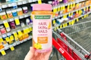 hand holding natures bounty hair skin and nails gummies