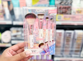 hand holding Joah makeup brush set in aisle