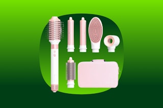 A hair dryer and air styler with six attachments: 3 brushes, 2 curling irons, and a hair dryer with a carry case