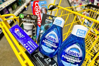 colgate toothpaste, toothbrush, crest toothpaste, air wick warmer, axe car scent and 2 dawn powerwash in a cart